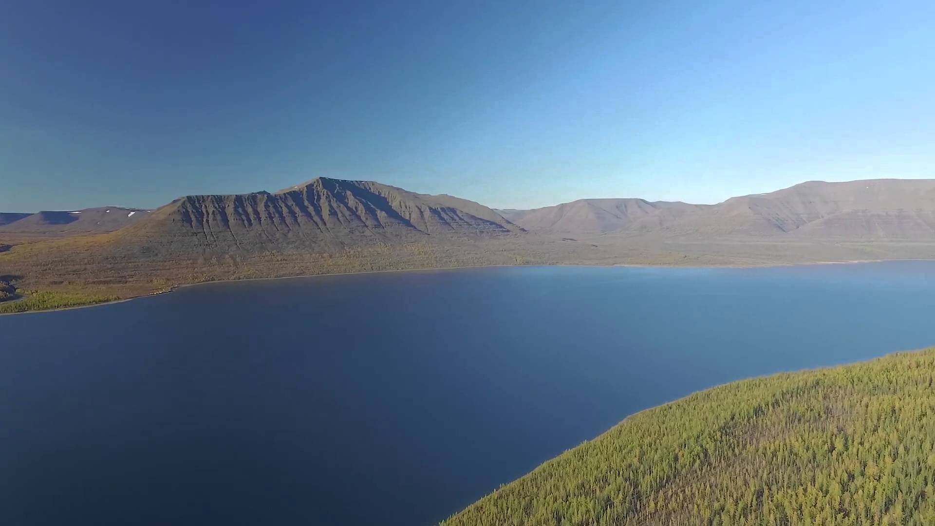 Длинной блистающей полосой тянется таймырское озеро. Озеро лама плато Путорана. Таймыр озеро лама. Озеро лама Норильск. Озеро байкуратурка лама.